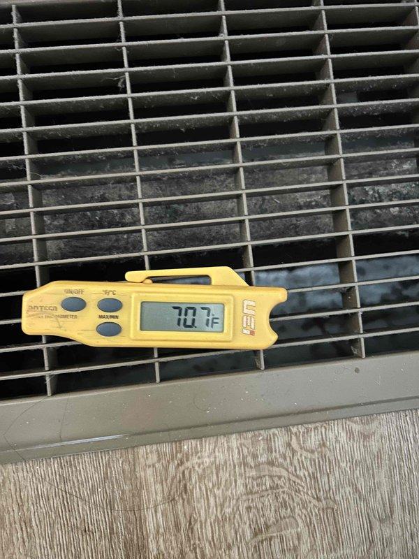 Responded to callback for upstairs furnace not operating following recent repair. Upon arrival, performed diagnostic testing of 3-year-old unit using digital multimeter and temperature measurements. Verified supply air temperature at 70.7°F at register grille and conducted voltage testing at control board, measuring 50.7V at electrical connections. Inspected control board wiring harnesses and LED indicators to identify root cause of no-heat condition. Completed troubleshooting and restored unit to proper operation.