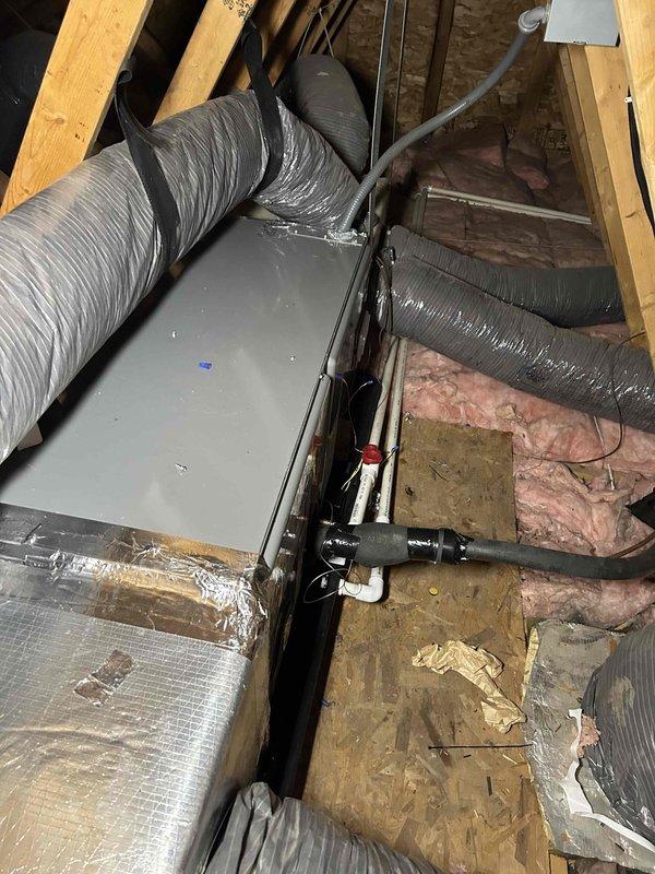 Completed full residential HVAC system replacement with installation of RUUD 14.3 SEER2 two-stage 2-ton heat pump (RP14AY24AJ2NA), RUUD 2-ton air handler (RH2TY2417STANNJ), and RUUD 10KW heat kit (RXBH-1724A10J-B) with digital thermostat. Installed outdoor unit on pad with snow legs, electrical whip kit, and disconnect box. Applied refrigerant line insulation and installed refrigerant line filter. Configured air handler in attic space with trap, SS2 coil drain safety water sensor, ceiling saver overflow drain pan with water sensor, transition to existing ductwork, and standard-sized air filter rack. Obtained applicable permits, removed and disposed of existing equipment, and completed all electrical connections per code requirements. System tested and operational with 1-year labor warranty and 10-year parts warranty provided.