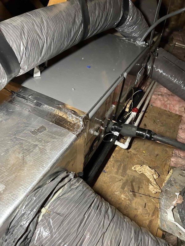 Completed full residential HVAC system replacement with installation of RUUD 14.3 SEER2 two-stage 2-ton heat pump (RP14AY24AJ2NA), RUUD 2-ton air handler (RH2TY2417STANNJ), and RUUD 10KW heat kit (RXBH-1724A10J-B) with digital thermostat. Installed outdoor unit on pad with snow legs, electrical whip kit, and disconnect box. Applied refrigerant line insulation and installed refrigerant line filter. Configured air handler in attic space with trap, SS2 coil drain safety water sensor, ceiling saver overflow drain pan with water sensor, transition to existing ductwork, and standard-sized air filter rack. Obtained applicable permits, removed and disposed of existing equipment, and completed all electrical connections per code requirements. System tested and operational with 1-year labor warranty and 10-year parts warranty provided.