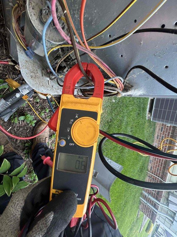 Completed monthly spring/summer maintenance on attic-mounted heat pump and air handler system accessed through garage. Performed electrical diagnostics using clamp meter on system wiring, recording amperage readings of 0.3A, and replaced 20x20x1 Glasfloss air filter as part of routine Club Single maintenance protocol.