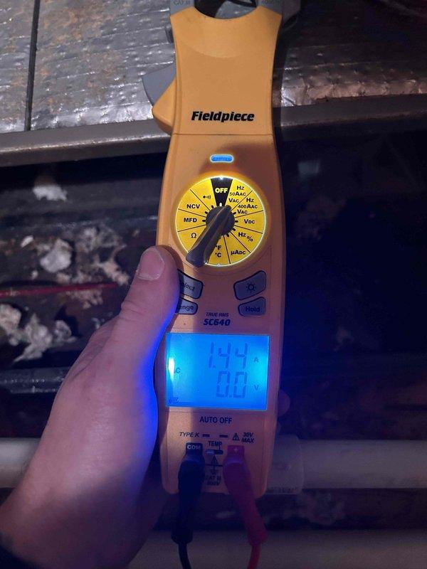 Completed monthly spring/summer maintenance on attic-mounted heat pump system accessible through garage. Performed electrical diagnostics using digital multimeter, measuring voltage and capacitance readings to verify proper system operation. Inspected condenser unit electrical components, control board, and wiring connections, confirming all circuits functioning within normal parameters.
