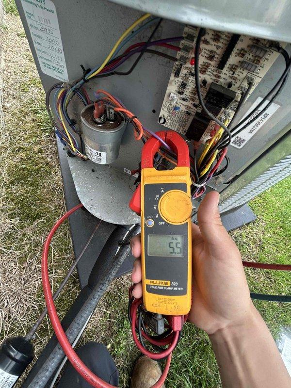 Performed routine spring/summer maintenance on heat pump and air handler system located in attic with garage access. Conducted electrical diagnostics using clamp meter, measuring compressor amperage at 5.5 amps and verifying proper current draw at 6 amps on system components. Inspected capacitor connections, control board operation, and all electrical wiring for proper function and safety compliance.