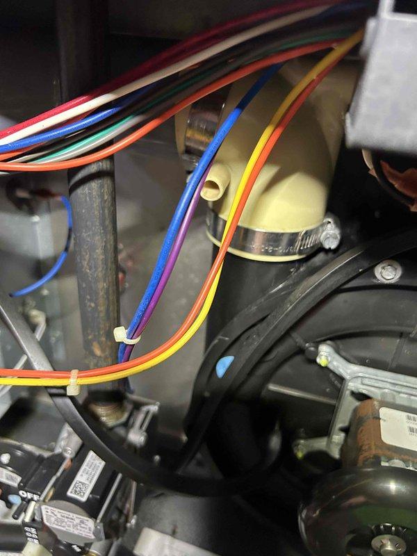 Responded to no-cooling complaint on upstairs 5-6 year old air conditioning system. Upon arrival, confirmed indoor unit was blowing warm air. Performed diagnostic evaluation of the system including visual inspection of indoor air handler components and refrigerant system. Measured supply air temperature at 53.2°F, indicating inadequate cooling performance. Inspected electrical connections, control board, blower motor assembly, and refrigerant lines. Documented system conditions with photographs showing internal components and temperature readings for further assessment and repair recommendations.