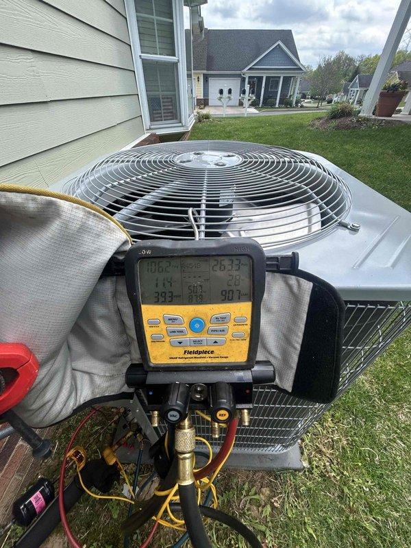 Completed monthly spring/summer maintenance on Payne heat pump system with air handler located in attic. Performed comprehensive system diagnostics using Fieldpiece gauges to verify refrigerant pressures and temperatures, inspected outdoor condenser unit operation, and checked all electrical connections. Confirmed system operating within manufacturer specifications and replaced 20x20x1 air filter in attic air handler to maintain proper airflow and indoor air quality.