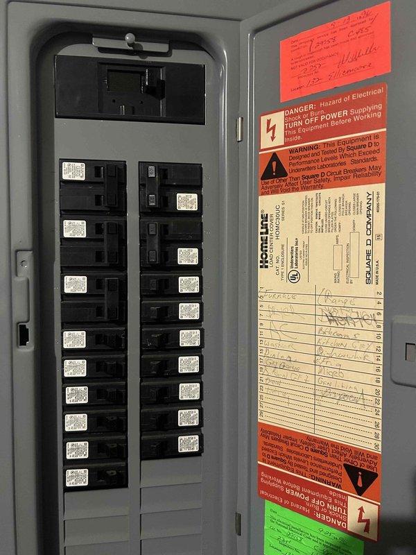 Completed comprehensive HVAC system inspection for pre-sale property evaluation and documented electrical panel configuration with 100-amp main breaker and circuit distribution system. Photographed electrical service equipment showing Square D Homeline load center with properly labeled circuit directory and safety compliance labeling, and captured images of main disconnect breaker rated at 100 amps for documentation purposes requested by property stakeholders.