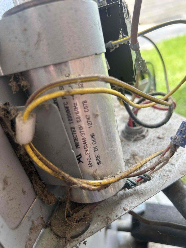 Responded to service callback for outdoor unit making unusual noise. Previous technician found no issues during initial visit. Upon arrival, performed diagnostic evaluation of condenser fan motor and compressor operation. Measured current draw at 383.1 amps using clamp meter to assess electrical performance. Inspected condenser fan motor showing signs of age, weathering, and dirt accumulation. Verified electrical connections on motor leads, noting some discoloration and potential corrosion at connection points. Recommended thorough inspection of contactor and capacitors to rule out electrical component failure before determining if condenser fan motor or compressor replacement is necessary.