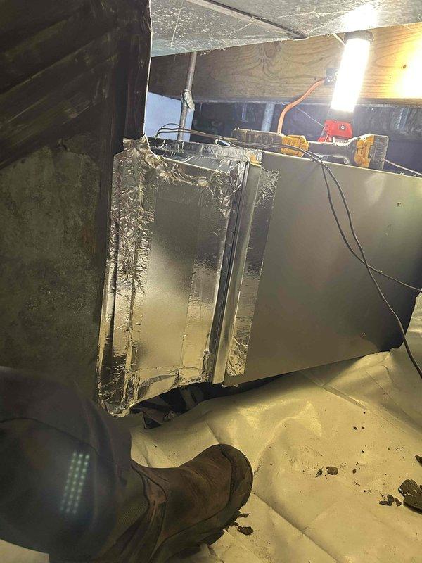 Completed full replacement of residential gas furnace with Bryant 80% efficiency single-stage Legacy Series unit, model 800SB42090M17, rated at 90,000 BTU with 3.5 ton capacity. Removed and properly disposed of existing furnace equipment from attic installation location. Installed new furnace with transition to existing evaporator coil, standard-sized air filter rack, and connected to existing flue piping system. Completed all electrical connections including disconnect switch, installed gas shut-off switch with flexible gas line connector, and verified flame roll-out protection safety devices. Utilized existing thermostat and wiring. Protected crawlspace barrier during equipment transport using PVC pipe as rolling surface to prevent damage. Obtained necessary permits and ensured all work met current code compliance standards. System tested and operational upon completion.