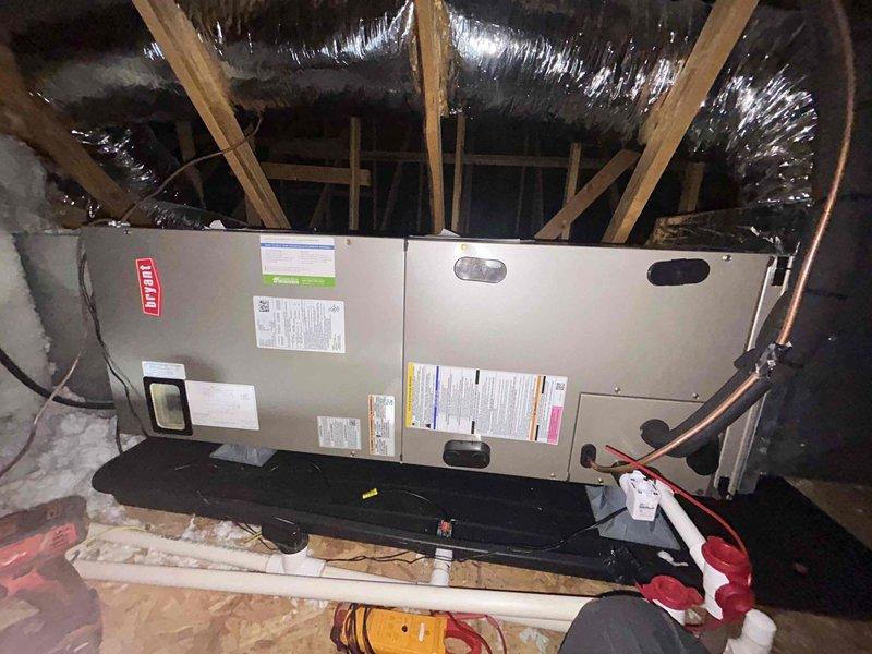 Completed monthly spring/summer club maintenance on Bryant air handler unit located in attic space above garage. Performed comprehensive system inspection including filter replacement with 20x20x1 filter, temperature readings, condensate drain verification, and visual inspection of ductwork and electrical connections. All components operating within normal parameters with supply air temperature measured at appropriate cooling range.