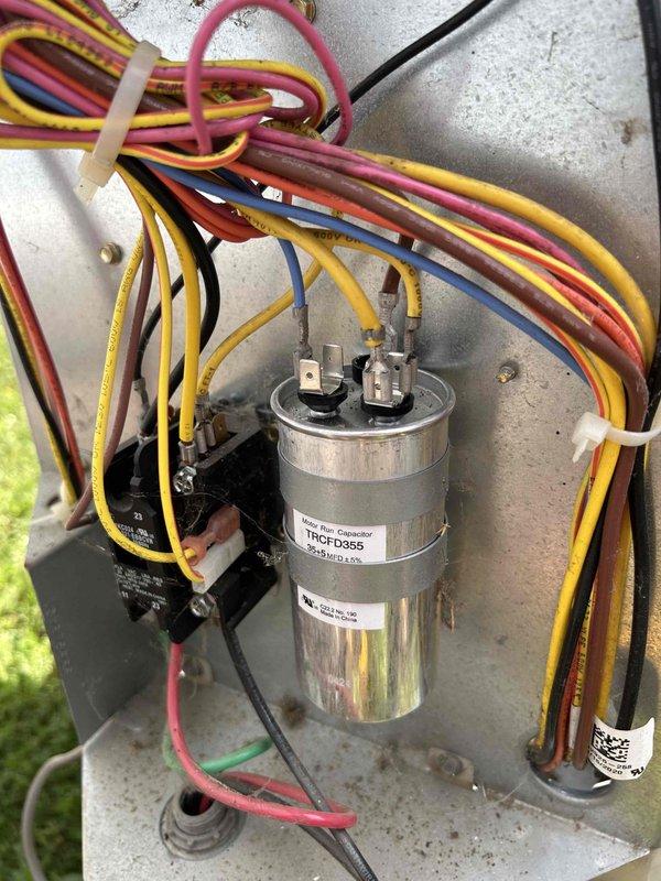 Completed monthly spring/summer preventive maintenance on heat pump and air handler system located in attic accessible through garage. Inspected electrical components including contactor and dual-run capacitor (TRCFD355), verified capacitance readings at 45.9 MFD using calibrated multimeter, confirmed all wire connections secure, and documented system operating within normal parameters.