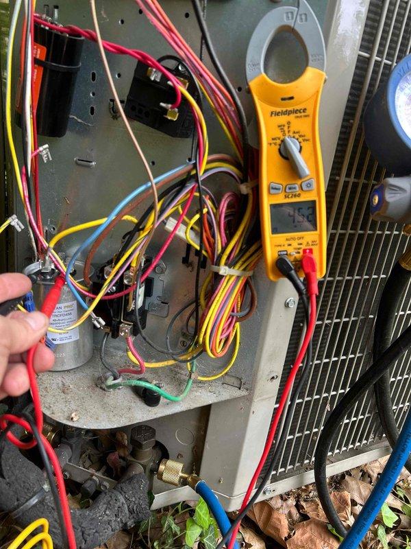 Completed preventive maintenance tune-up on heat pump system with air handler located in hallway. Performed comprehensive electrical diagnostics using clamp meter to verify proper amperage draws and system performance. Inspected and tested capacitor, contactor, and all electrical connections within the unit. Verified proper operation of all components, checked refrigerant pressures, and confirmed system is functioning within manufacturer specifications. Cleaned washable filter and ensured outdoor unit condenser coils were free of debris for optimal airflow and efficiency.