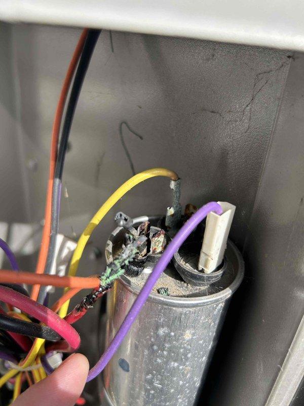 Completed Care Plan Tune Up on basement air conditioning unit with gas furnace. Inspected and addressed customer concern of unit not cooling. Upon inspection, discovered burnt and corroded wire connections at capacitor terminals. Replaced failed capacitor and repaired damaged wire connections. Checked refrigerant pressures due to unit's history of low charge; pressures were found to be within manufacturer specifications at this time. Tested system operation and verified proper cooling function restored.