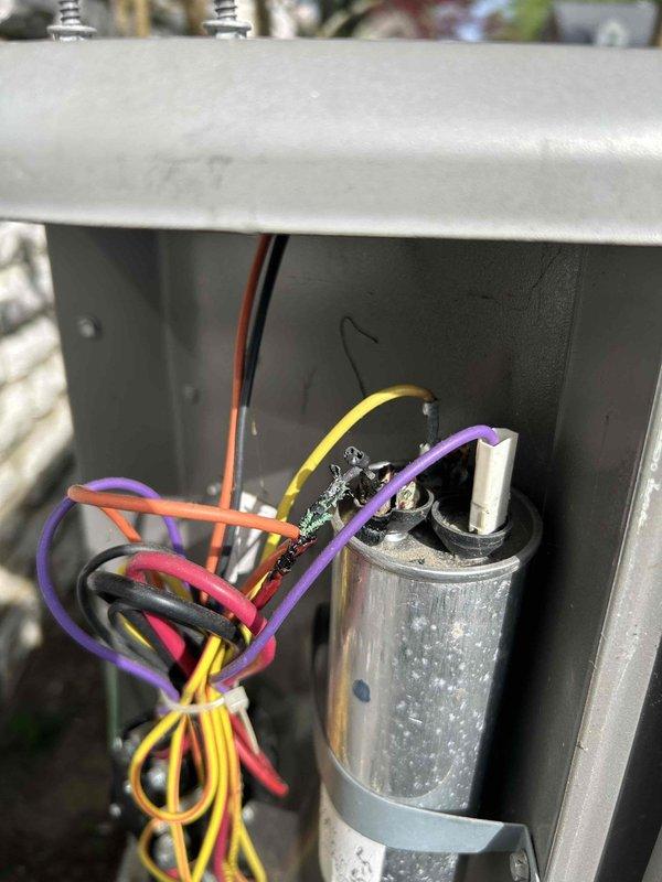 Completed Care Plan Tune Up on basement air conditioning unit with gas furnace. Inspected and addressed customer concern of unit not cooling. Upon inspection, discovered burnt and corroded wire connections at capacitor terminals. Replaced failed capacitor and repaired damaged wire connections. Checked refrigerant pressures due to unit's history of low charge; pressures were found to be within manufacturer specifications at this time. Tested system operation and verified proper cooling function restored.
