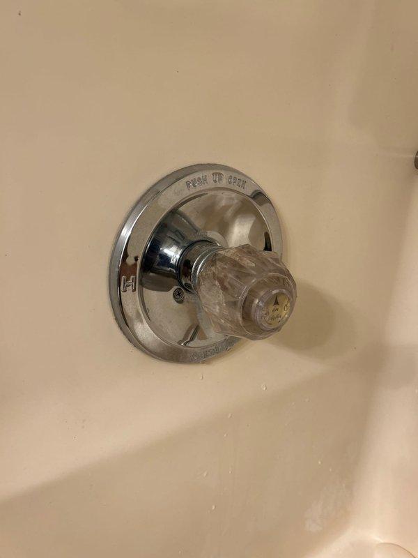 Completed routine plumbing inspection including examination of upstairs spare bathroom shower fixture and roof exhaust vent. Inspected shower control valve and handle assembly, which showed normal wear consistent with age but remained functional. Verified roof-mounted exhaust flue pipe and rain cap for proper installation and potential leak points, finding components secure with no visible deterioration or water intrusion issues.