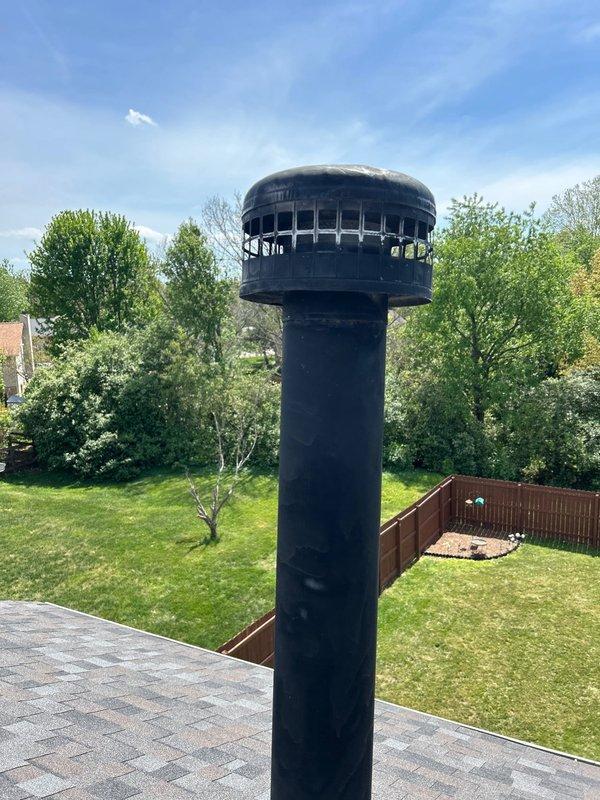 Completed routine plumbing inspection including examination of upstairs spare bathroom shower fixture and roof exhaust vent. Inspected shower control valve and handle assembly, which showed normal wear consistent with age but remained functional. Verified roof-mounted exhaust flue pipe and rain cap for proper installation and potential leak points, finding components secure with no visible deterioration or water intrusion issues.