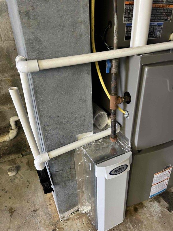 Completed full residential HVAC system installation including Lennox Merit Series 96% efficient 70,000 BTU two-stage furnace (ML296UH070XV36BK), matching evaporator coil (CK40CT-30/36B-71), Lennox Merit Series 15.5 SEER2 2-ton two-stage AC condensing unit (ML17KC2-024-230), and Lennox M30 touchscreen smart programmable thermostat. Repositioned existing outdoor unit to face line set toward residence, repaired and secured thermostat wiring on unit. Applied foil-backed insulation to supply transition, installed all refrigerant lines and electrical connections, completed condensate drainage system with PVC piping, and connected gas line to furnace. Removed and properly disposed of all existing equipment, obtained applicable permits, tested system operation, and verified all components functioning to manufacturer specifications.