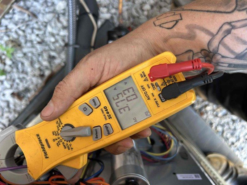 Completed comprehensive dual-system Care Plan maintenance on heat pump and air handler units located in crawlspace and attic. Performed full system diagnostics including electrical testing with multimeter to verify proper voltage, capacitance readings at 5.05 MFD, and overall system performance on both units. Inspected all accessible components, connections, and ductwork insulation for both systems to ensure optimal operation and efficiency.