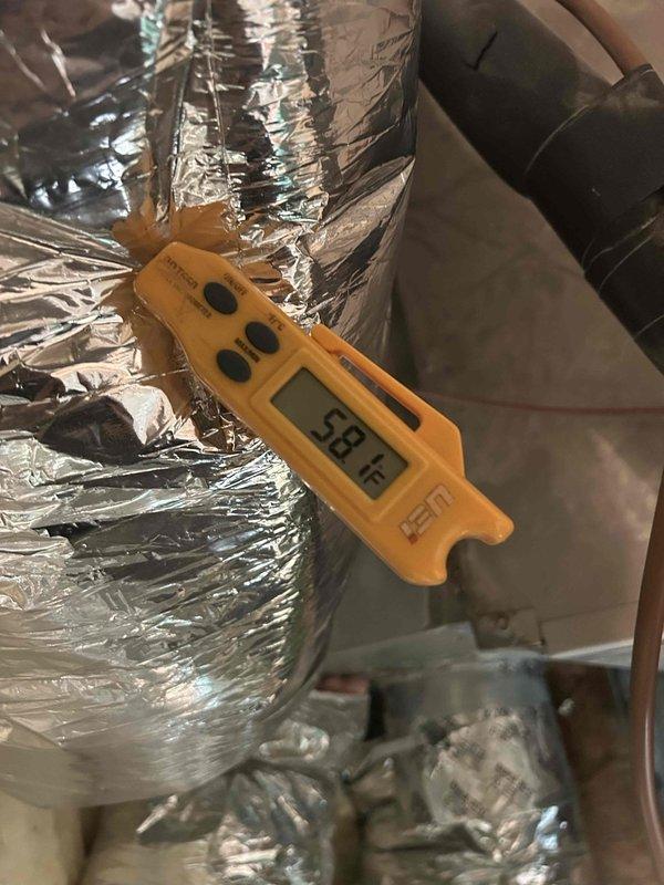 Completed routine AC tune-up maintenance on a 12-year-old cooling system located in the attic. Performed standard system diagnostics, verified capacitor specifications at 25µF, and measured supply air temperature at 58°F at the ductwork. All components inspected and found operating within normal parameters; system is functioning properly with no issues identified.