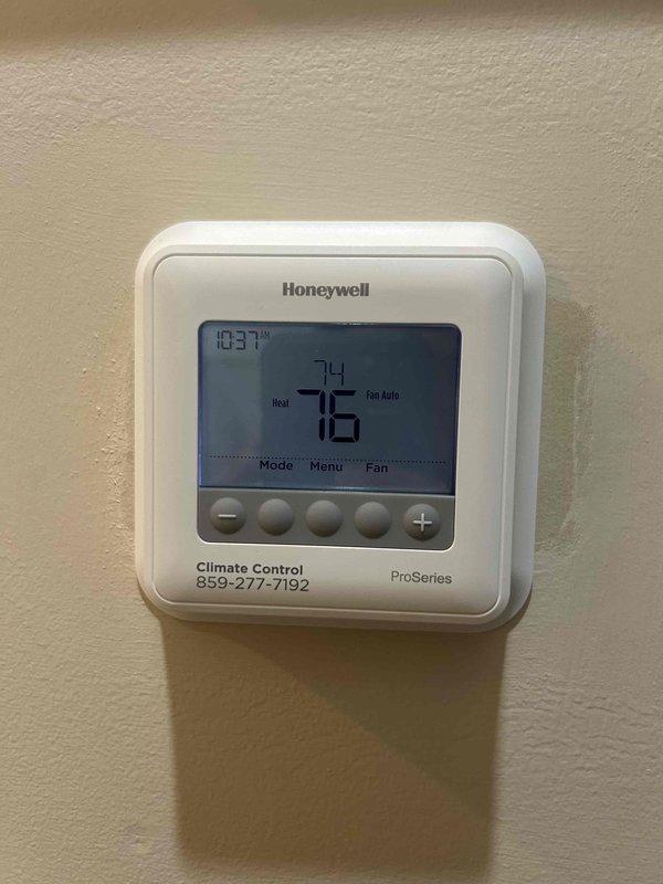 Completed routine care plan maintenance on heat pump and air handler system located in attic. Performed comprehensive tune-up procedures, verified thermostat operation showing 76°F ambient with 74°F setpoint, and recorded system diagnostics including 53.6°F measurement at ductwork. Customer provided their own filter for installation, and documentation was photographed for records with invoice copy to be mailed per customer request.