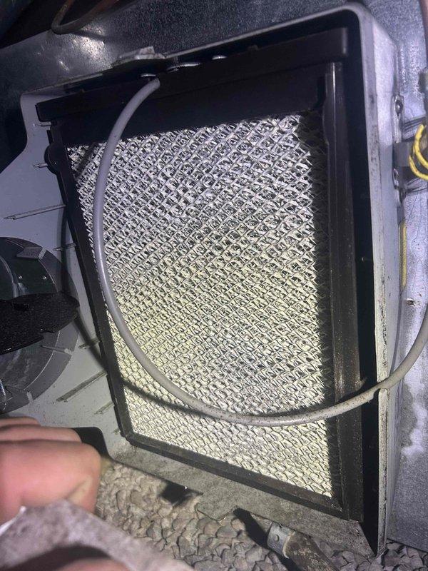 Completed comprehensive Care Plan tune-up on heat pump and air handler system with humidifier located in crawlspace. Inspected and replaced 20x20x1 air filter provided by customer, which showed significant dust accumulation and discoloration. Performed electrical diagnostics using clamp meter, verified capacitor readings at 5 microfarads, and confirmed all system components operating within manufacturer specifications. Humidifier unit #35 serviced as included in maintenance plan.