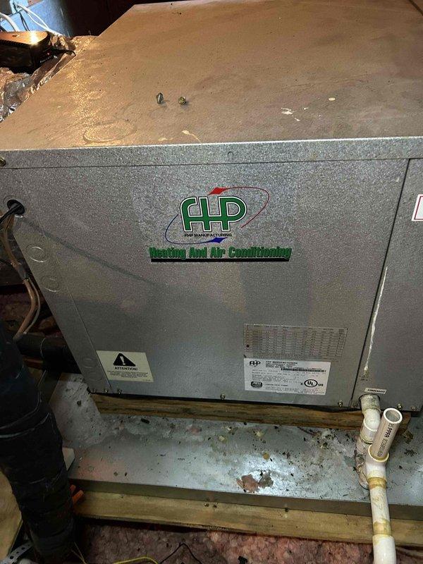 Responded to service call for non-operational 15-year-old geothermal air conditioning system with reported blower fan failure. Coordinated gate access call prior to arrival for evening appointment window. Upon inspection, accessed attic-mounted air handler unit and assessed system components including condensate drainage lines and refrigerant piping connections. Documented existing equipment condition showing age-appropriate wear, moisture accumulation on insulated refrigerant lines, and water staining around condensate connections indicating previous drainage activity. Photographed air handler installation, ductwork connections, electrical wiring, and PVC condensate drain routing for service records. Evaluated blower motor operation, electrical supply to unit, and overall system functionality to diagnose reported cooling failure and determine necessary repairs for geothermal heat pump system.