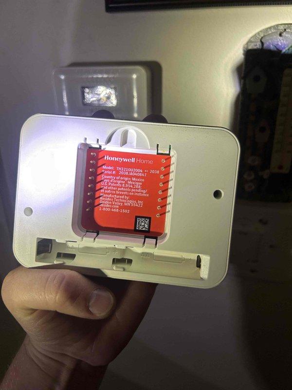 Responded to no heat call on gas furnace system less than 10 years old. Upon arrival, verified thermostat was not switching from cooling to heating mode, preventing system operation. Inspected Honeywell Home thermostat model TH2211017DG and identified malfunction preventing mode changeover. Removed thermostat from wall mount and examined internal circuit board and wiring connections. Confirmed supply air temperature at floor register measured 58.2°F, indicating lack of heat delivery. Diagnosed thermostat failure as root cause of heating system lockout. Reviewed system operation with homeowner and provided recommendations for thermostat replacement to restore proper heating function.