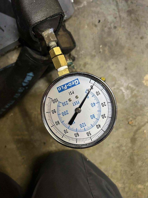 Completed Care Plan tune-up on geothermal heat pump system with dual GEOLINK circulation pumps located in basement. Inspected and tested both circulation pumps, verified proper operation of pump controls, and measured system pressures using calibrated gauge to ensure geothermal loop is within manufacturer specifications.
