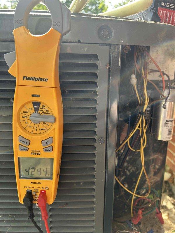 Completed annual maintenance visit on gas furnace, air conditioning system, and humidifier unit as part of scheduled fall/winter preventive maintenance program. Performed comprehensive system inspection with panel removed to access internal electrical components and wiring. Utilized digital clamp meter to verify electrical performance, recording operating amperage of 42.41 amps and voltage reading of 243.0 volts to confirm proper system operation. Inspected all electrical connections, including yellow, red, and white wiring harnesses, and examined copper refrigerant lines for integrity. All components found operating within normal parameters with no deficiencies noted. System left in proper working condition.