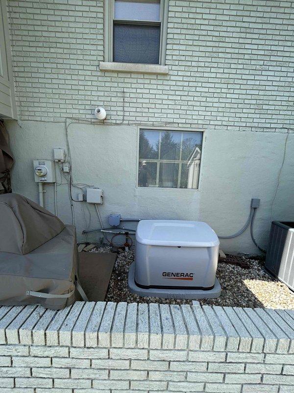 Completed electrical installation of new Generac backup generator system at residential property. Relocated existing generator unit and installed new generator on gravel pad with proper grounding and conduit connections. Performed all electrical panel integration work, including breaker installation, load center wiring, and transfer switch connections to ensure seamless automatic power transfer during utility outages. Verified all electrical connections meet code requirements and tested system operation for proper functionality.