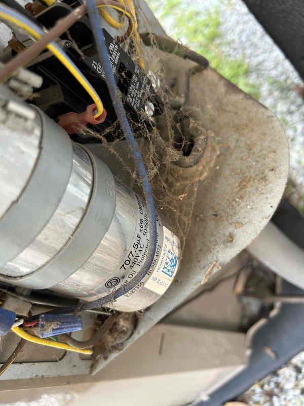 Responded to no cooling complaint at commercial church facility. Upon inspection, found blower motor assembly heavily contaminated with dust and debris buildup, restricting airflow and causing system performance issues. Measured supply air temperature at 57.5°F, confirming reduced cooling capacity. Documented motor condition and ductwork assembly showing significant dirt accumulation on mounting brackets and electrical connections. Identified need for thorough system cleaning and potential motor servicing to restore proper airflow and cooling function.