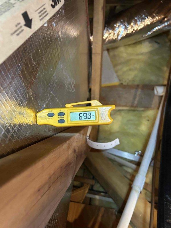 Performed maintenance tune-up on Rheem gas furnace system located in attic space, addressing customer concerns regarding intermittent musty odors from supply vents. Conducted comprehensive system inspection including temperature differential measurements across supply and return air streams, recording supply air temperature of 63.8°F and temperature rise of 32.5°F, confirming proper heat exchanger operation and combustion efficiency. Inspected ductwork, insulation, and attic air handler installation for moisture intrusion, microbial growth, or condensation issues that could contribute to odor concerns; recommended monitoring system performance and consideration of duct cleaning or UV light installation if odors persist.