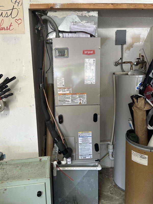 Completed full residential heat pump system installation including Bryant 15 SEER2 3-ton outdoor heat pump unit (model GH5SAN53600A) and 3-ton air handler (model FJ5ANXB36L00) mounted in garage with integrated 15KW heat kit (model TU-EC-15BKB). Removed and properly disposed of existing HVAC equipment. Installed outdoor unit on new concrete pad with snow legs, electrical disconnect box, and electrical whip kit. Applied refrigerant line insulation and installed refrigerant line filter. Indoor air handler installation included trap, SS2 coil drain safety water sensor, overflow drain pan with water sensor for ceiling protection, transition to existing ductwork, and standard-sized air filter rack. Utilized existing thermostat to maintain customer preference. All electrical connections completed to code specifications with proper conduit routing. System charged with refrigerant, tested for proper operation across all modes including heating and cooling cycles. Verified airflow, temperature d