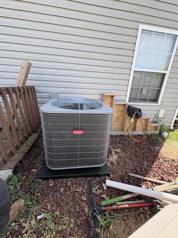 Completed full residential heat pump system installation including Bryant 15 SEER2 3-ton outdoor heat pump unit (model GH5SAN53600A) and 3-ton air handler (model FJ5ANXB36L00) mounted in garage with integrated 15KW heat kit (model TU-EC-15BKB). Removed and properly disposed of existing HVAC equipment. Installed outdoor unit on new concrete pad with snow legs, electrical disconnect box, and electrical whip kit. Applied refrigerant line insulation and installed refrigerant line filter. Indoor air handler installation included trap, SS2 coil drain safety water sensor, overflow drain pan with water sensor for ceiling protection, transition to existing ductwork, and standard-sized air filter rack. Utilized existing thermostat to maintain customer preference. All electrical connections completed to code specifications with proper conduit routing. System charged with refrigerant, tested for proper operation across all modes including heating and cooling cycles. Verified airflow, temperature d