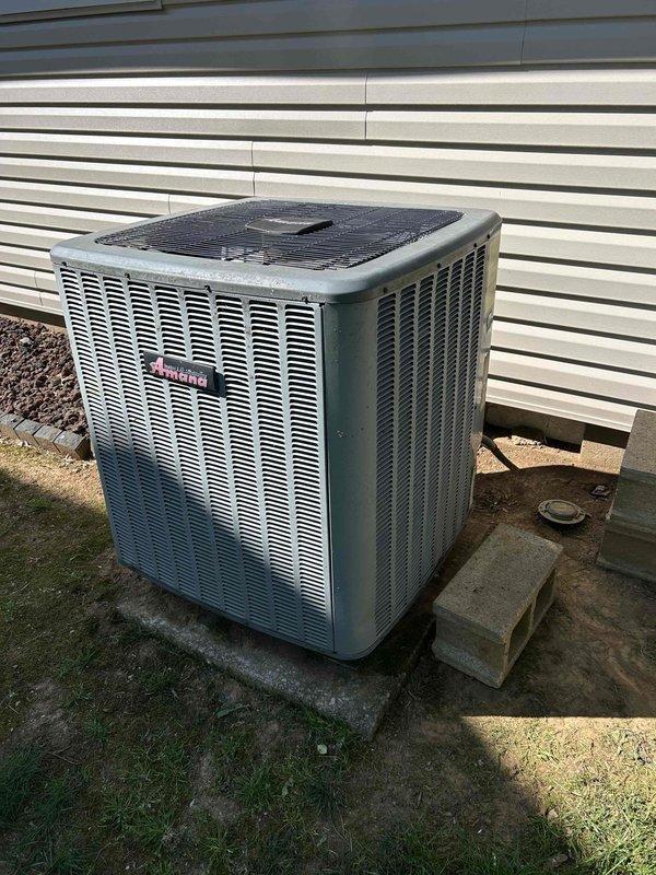 Responded to no heat call on 5-year-old Bryant heat pump system that stopped producing warm air overnight. Upon arrival, performed diagnostic inspection of outdoor condenser unit and electrical components. Inspected capacitor and associated wiring connections, including red, purple, brown, and yellow wire terminals. Verified proper electrical connections to capacitor terminals and checked component condition. System evaluated and capacitor inspected for proper operation to restore heating functionality to the heat pump unit.