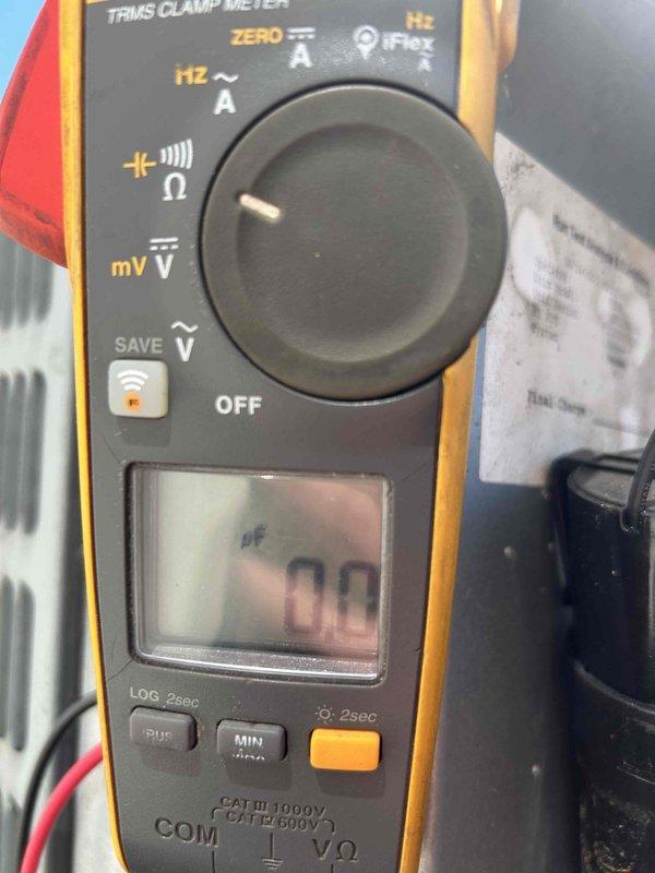 Responded to no cooling complaint on 12-year-old heat pump system. Upon inspection, diagnosed failed dual run capacitor (CAP050400440R1) on outdoor unit. Verified capacitor failure using clamp meter with amperage readings confirming compressor was not operating within normal parameters. Replaced defective capacitor and tested system operation. Unit restored to proper cooling function with compressor and condenser fan motor running at correct amperage. Customer advised that due to system age and presence of multiple units on property, they should anticipate potential replacement needs in the near future.