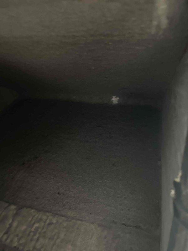 Performed commercial HVAC coil cleaning service on two evaporator coils located in confined crawl space area. Coils exhibited significant dust and debris accumulation on aluminum fins, restricting airflow and reducing system efficiency. Thoroughly cleaned both coil assemblies, removing accumulated particulate matter from fin surfaces and surrounding ductwork to restore proper heat transfer capabilities and optimize unit performance.