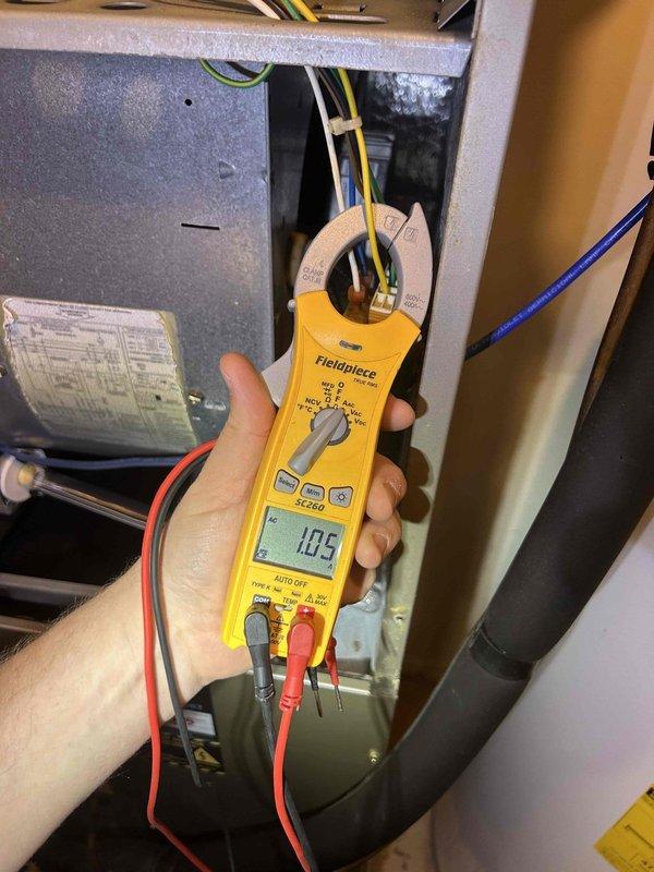 Completed Gold Level prepaid maintenance on a 12-year-old heat pump and air handler system located in laundry room and sun room. Performed comprehensive inspection and diagnostic testing including electrical measurements using clamp meter, recording amperage and voltage readings to verify proper system operation. Mini-split unit was excluded from service per customer request, with maintenance focused solely on the main HVAC unit. Customer provided filters for the service visit.