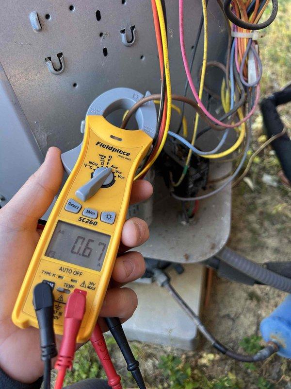 Completed Gold Level prepaid maintenance on a 12-year-old heat pump and air handler system located in laundry room and sun room. Performed comprehensive inspection and diagnostic testing including electrical measurements using clamp meter, recording amperage and voltage readings to verify proper system operation. Mini-split unit was excluded from service per customer request, with maintenance focused solely on the main HVAC unit. Customer provided filters for the service visit.
