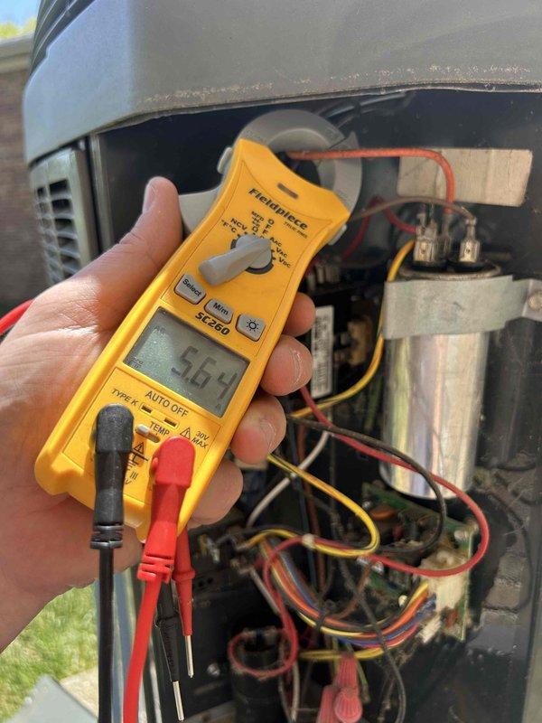 Responded to no cooling call on 10+ year old dual fuel system. Performed diagnostic testing of outdoor unit electrical components including capacitor and contactor using digital multimeter, with readings indicating proper voltage. Completed maintenance tune-up service on system, addressed furnace door alignment issue preventing proper closure, and inspected air filter track where filter was becoming stuck during installation. System operational upon completion with all electrical components testing within normal parameters.