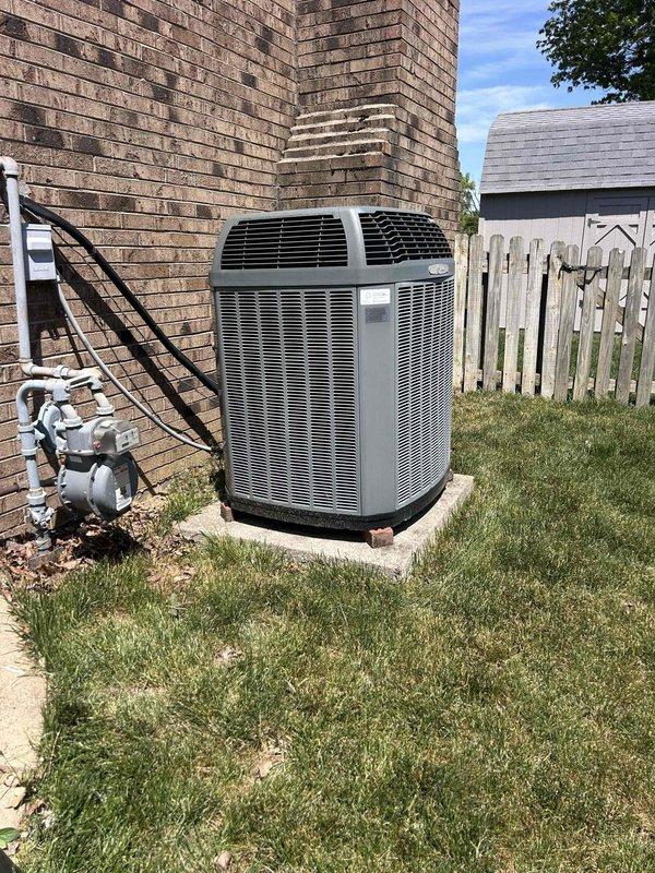 Responded to no cooling call on 10+ year old dual fuel system. Performed diagnostic testing of outdoor unit electrical components including capacitor and contactor using digital multimeter, with readings indicating proper voltage. Completed maintenance tune-up service on system, addressed furnace door alignment issue preventing proper closure, and inspected air filter track where filter was becoming stuck during installation. System operational upon completion with all electrical components testing within normal parameters.