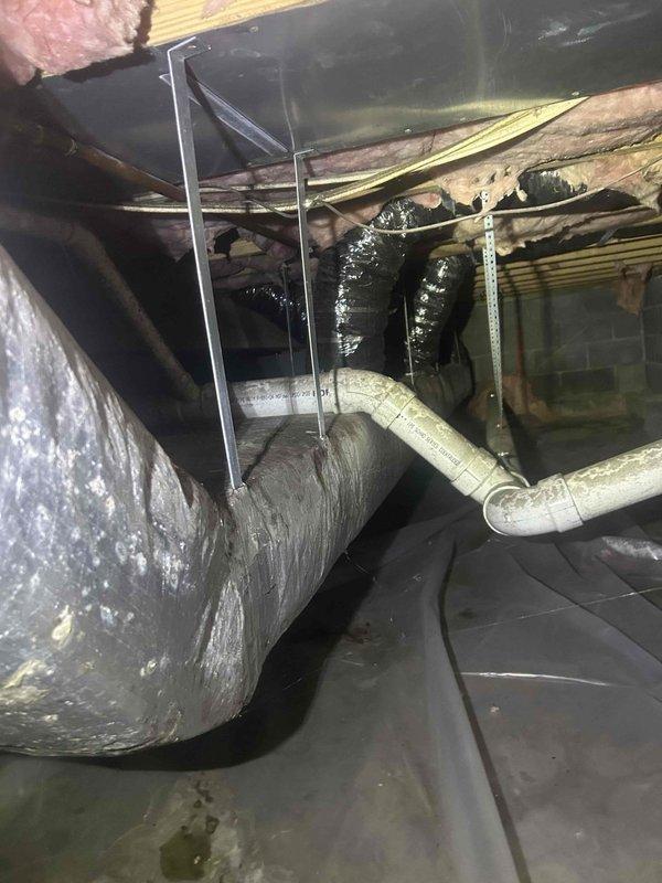 Responded to no cooling call on 20-year-old heat pump system with R22 refrigerant. Upon inspection in crawl space, diagnosed failed compressor contactor preventing outdoor unit from engaging. Replaced contactor, verified proper voltage and amperage draw, tested system operation through complete cooling cycle. System now cooling properly with all components functioning as designed.