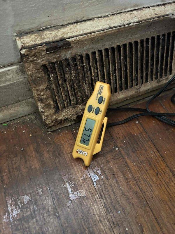 Responded to service call for loud rattling noise from AC unit and lack of cooling following recent gas furnace installation approximately two months prior. Upon arrival, inspected newly installed HVAC system and performed diagnostic assessment. Measured supply air temperature at floor register, recording 57.5°F, which indicated inadequate cooling performance. Verified thermostat settings showing system set to off position with fan on auto mode and indoor temperature reading of 70°F. Conducted visual inspection of accessible components and documented conditions of air distribution system, noting significant dust and debris accumulation at floor register vent requiring attention. Identified issues related to recent installation requiring further evaluation of refrigerant charge, airflow, and mechanical components to resolve rattling noise and restore proper cooling function.