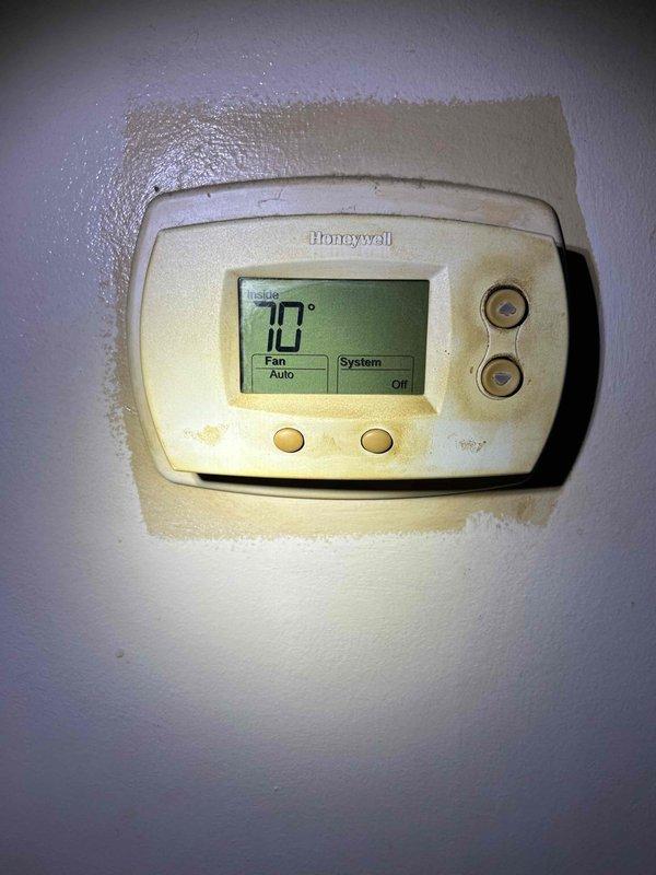 Responded to service call for loud rattling noise from AC unit and lack of cooling following recent gas furnace installation approximately two months prior. Upon arrival, inspected newly installed HVAC system and performed diagnostic assessment. Measured supply air temperature at floor register, recording 57.5°F, which indicated inadequate cooling performance. Verified thermostat settings showing system set to off position with fan on auto mode and indoor temperature reading of 70°F. Conducted visual inspection of accessible components and documented conditions of air distribution system, noting significant dust and debris accumulation at floor register vent requiring attention. Identified issues related to recent installation requiring further evaluation of refrigerant charge, airflow, and mechanical components to resolve rattling noise and restore proper cooling function.