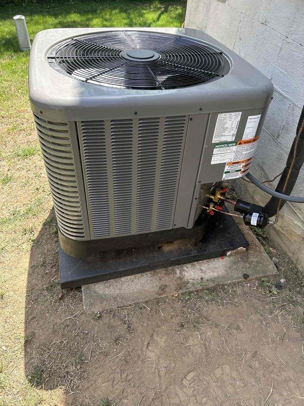 Replaced outdoor condensing unit under warranty authorization. Completed detailed specification sheets on both the failed unit prior to removal and the new replacement unit per technical service requirements. Documented new equipment with photographs of unit nameplate and installed system, verified proper refrigerant line connections, and confirmed unit operational parameters using digital HVAC testing instruments showing system temperatures and pressures within manufacturer specifications.
