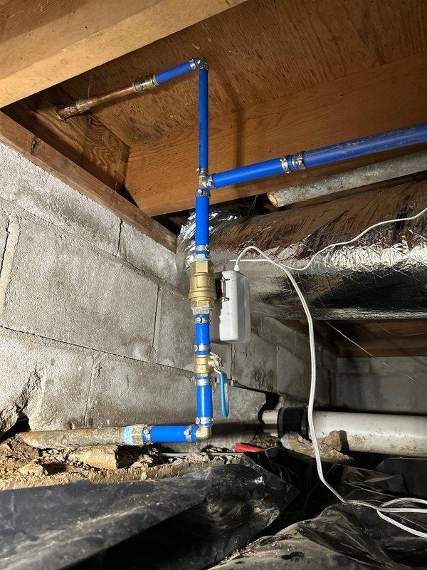 Addressed low water pressure issue in home reading 45 PSI following previous partial repipe. Replaced main shut-off valve and installed five feet of new pipe in crawlspace to restore adequate pressure. Relocated existing water heater shut-off valve from heater to main water service line and installed new dedicated shut-off valve at water heater for proper isolation capability.

Additionally repaired exterior hose bibb by installing new handle to restore functionality. All work completed using PEX piping with brass fittings and valves. System tested and operational upon completion.
