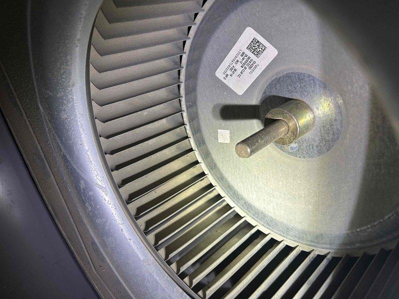 Completed routine HVAC maintenance on basement air handler unit. Inspected and photographed critical components including MARS capacitor and blower wheel assembly, confirming both were in good operating condition with minimal wear and proper functionality.