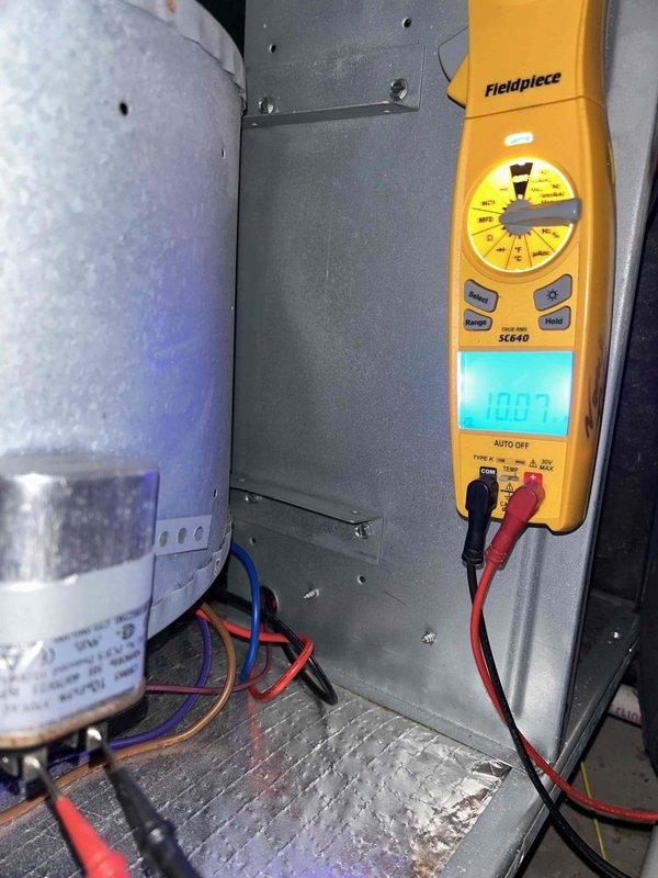 Completed preventive maintenance tune-up on dual HVAC system consisting of heat pump/air handler unit and heat pump/gas furnace unit located in garage and basement respectively. Performed comprehensive electrical diagnostics including capacitor testing with digital multimeter, verified all wire connections and contactors, inspected control panel components for proper operation, and confirmed system functionality. Customer provided X0587 filter for installation during service visit.