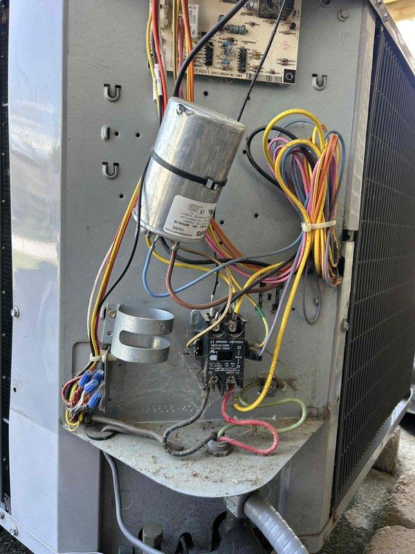 Completed comprehensive care plan tune-up on a 10-year-old heat pump air handler system located in basement utility closet. Accessed unit for full inspection, verified electrical components including capacitor and contactor operation, checked all wire connections and terminations, inspected heat exchanger coil condition, and assessed overall system functionality. Documented equipment condition with photos showing internal components and confirmed air filter availability on-site for proper system maintenance.