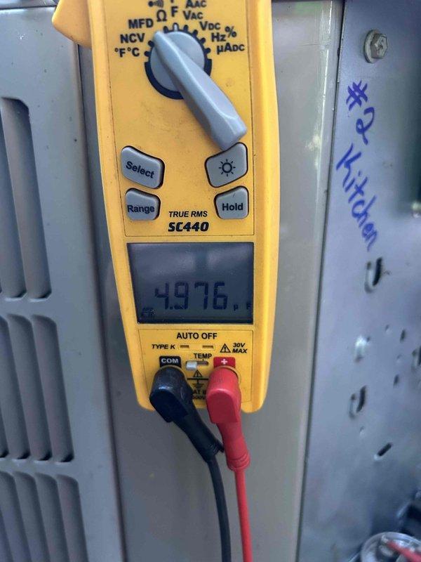 Completed comprehensive maintenance on Club Trio system consisting of three heat pumps, three air handlers, and two humidifiers, all located in basement. Performed full tune-up procedures on all units including electrical testing and voltage verification using calibrated test equipment, with readings confirming proper amperage draw of 14.6A and voltage at 4.976V on system components. Replaced Lennox HCWB3-17 humidifier pads and installed three Goodman-specific 20x25x5 filters (AMP-M81056) as needed across all air handlers.