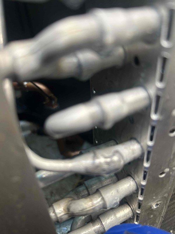 Replaced failed outdoor thermostatic expansion valve (TXV) on HVAC unit and recharged system with 11 pounds of refrigerant to restore proper cooling operation. All parts and labor covered under manufacturer warranty.