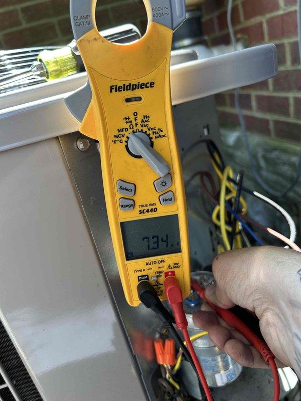 Completed Care Plan tune-up on dual HVAC system as part of club membership benefit included with recent installation. Performed comprehensive maintenance on gas furnace and air conditioning unit located in attic space. Conducted electrical diagnostics using clamp meter, recording amperage draw of 7.34 amps on system components to verify proper operation. Measured supply air temperature at 48.2°F to confirm adequate cooling performance. Inspected condenser coil, heat exchanger, and all accessible system components for proper operation and wear. Customer provided 16x25x1 air filter for installation. First system serviced and operating within normal parameters. Second system information pending for completion of full dual-system maintenance visit.